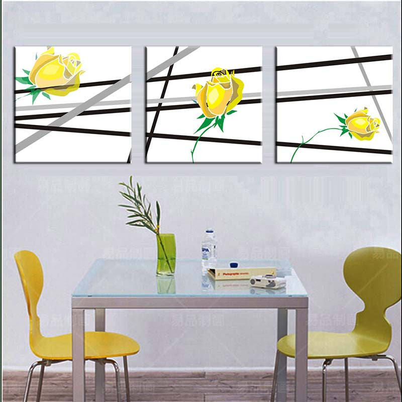 Yellow Flowers, Black Lines - Modern three-panel canvas art featuring minimalist yellow roses with green stems against white background intersected by bold black and gray diagonal lines, perfect for contemporary home decor