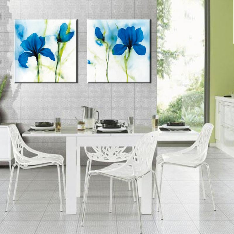 Blue Flower, Abstract Accents - 2 Piece canvas wall art featuring watercolor-style blue iris flowers with green stems on white background, displayed as split panels in modern dining room setting