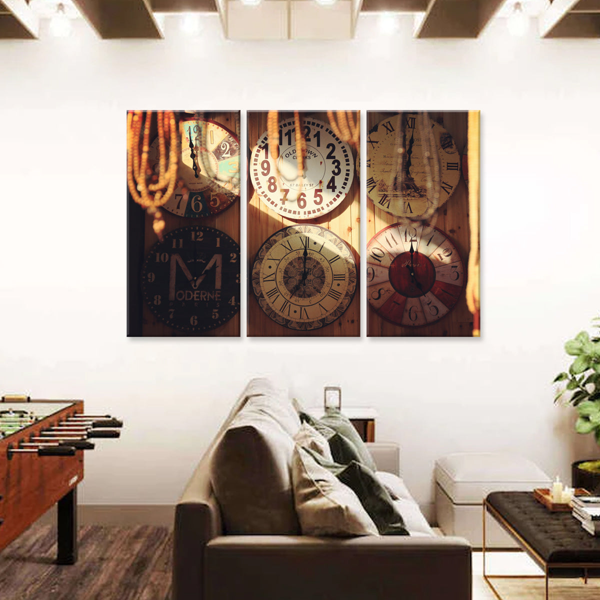 Clocks wall art featuring vintage-style clock faces in warm sepia tones, displayed as three panel canvas print above modern living room furniture, creating elegant home decor with timeless appeal