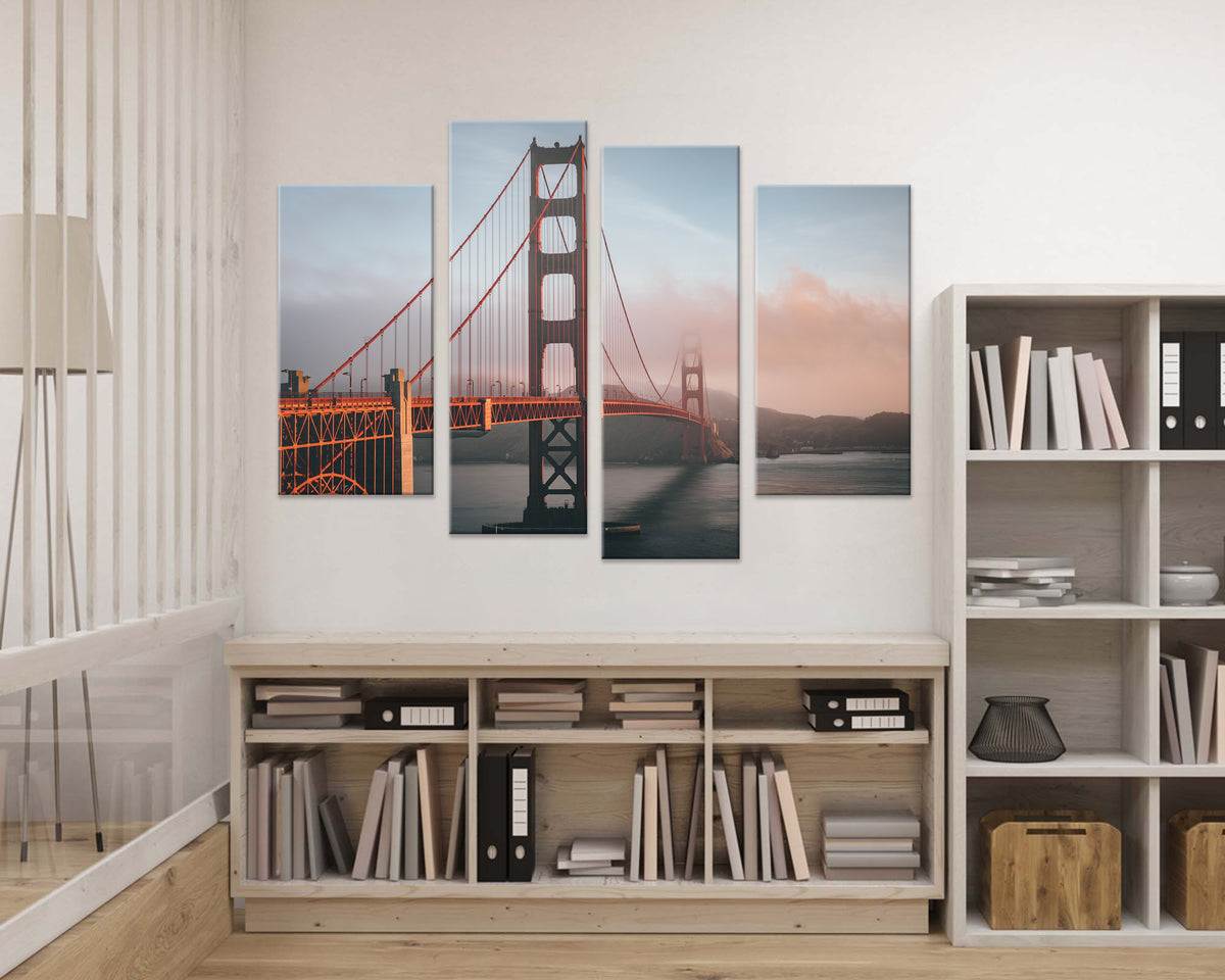 Golden Gate Bridge 4-panel canvas wall art displaying iconic San Francisco landmark at sunset, with orange steel towers against pastel sky, mounted above modern white storage furniture in contemporary room setting