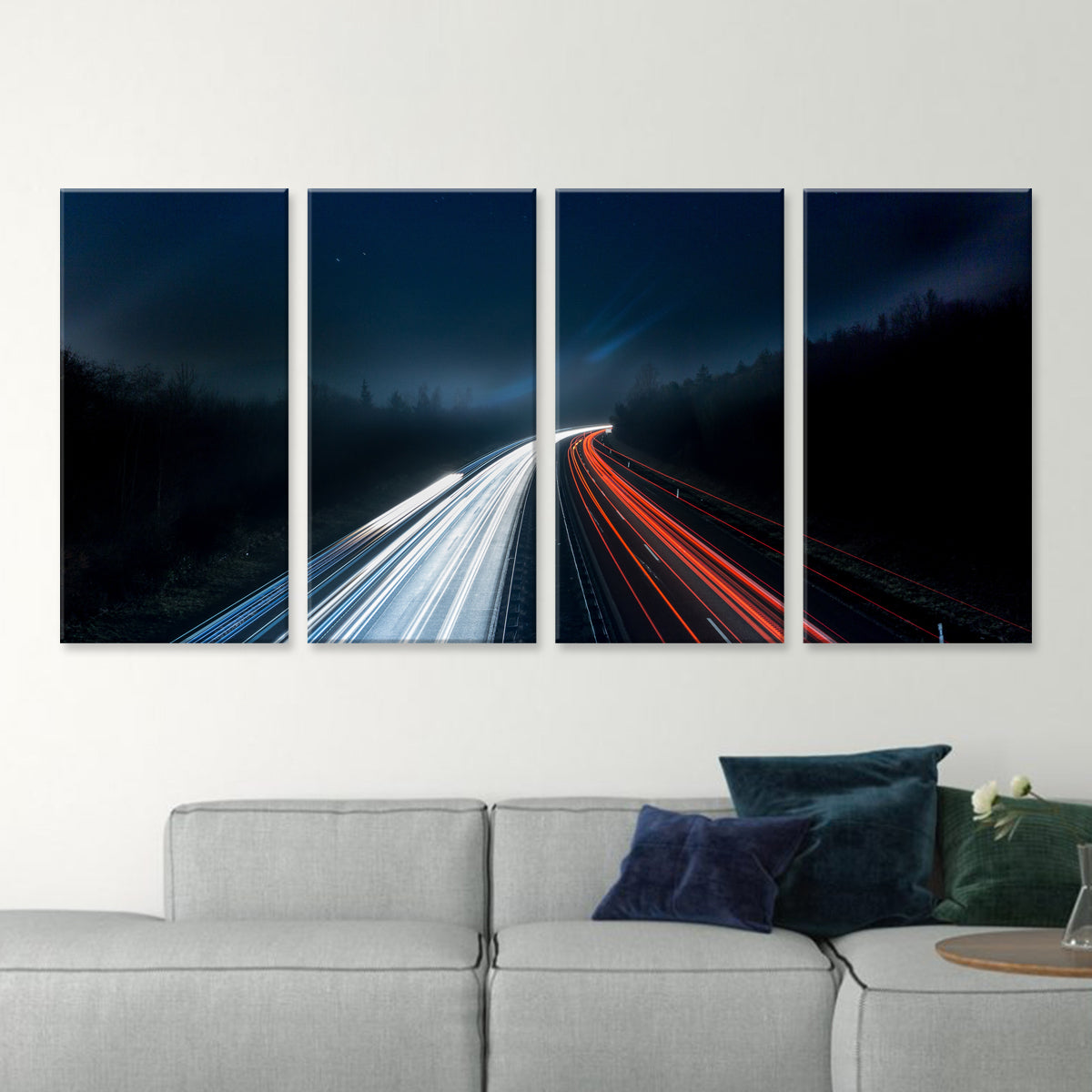 Highway Long Exposure - 4-panel canvas wall art featuring dramatic light trails of red and white car lights streaking through a dark highway at night, surrounded by silhouetted forest and deep blue sky