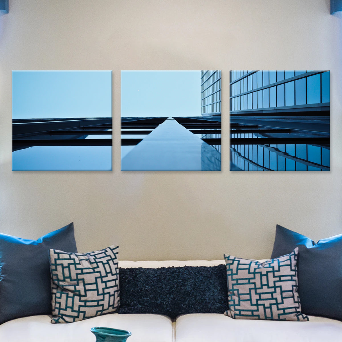 Worm's Eye View of a Building: Modern three-panel canvas art showing dramatic upward perspective of glass skyscraper with geometric lines and blue sky reflection, creating symmetrical architectural abstract