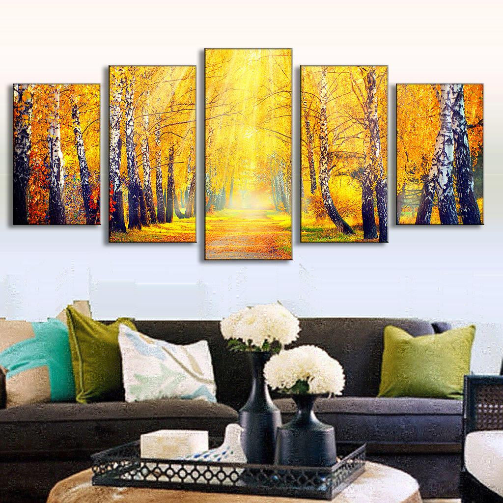 Forest in the Fall canvas wall art set featuring vibrant autumn birch trees with golden yellow leaves, sunlit pathway, and white tree trunks in five panels perfect for living room decor