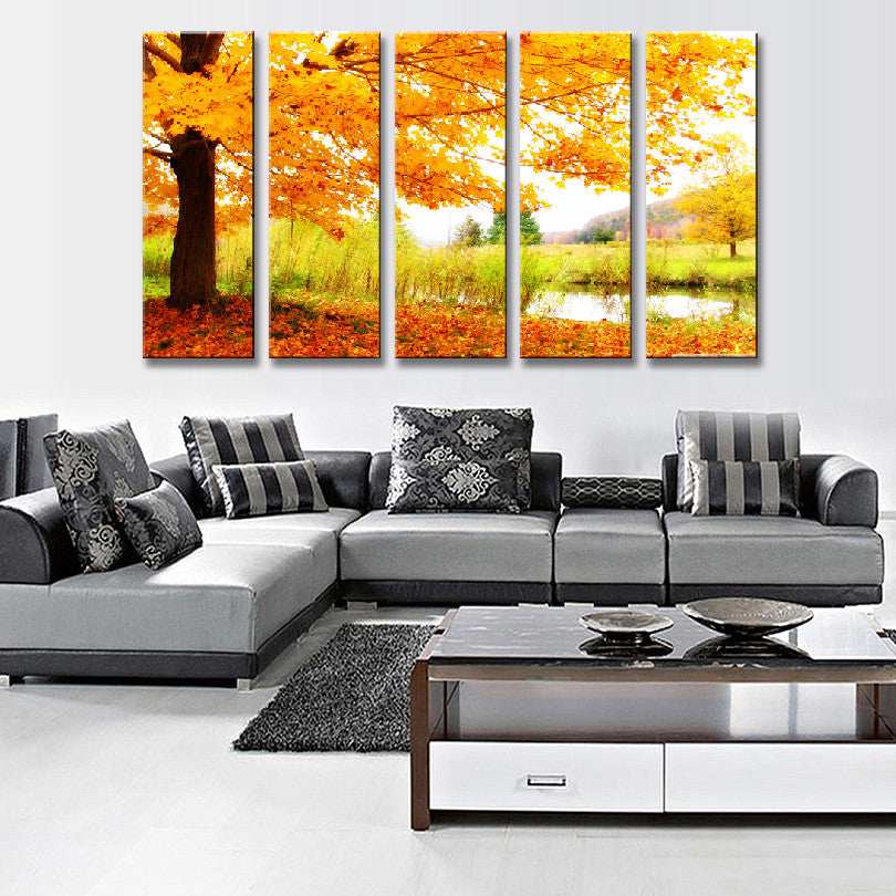 Maple Tree Fall Landscape - 5-panel canvas art showing vibrant autumn maple tree with golden-orange leaves against pond reflection, featuring tranquil meadow setting and warm fall colors in panoramic view