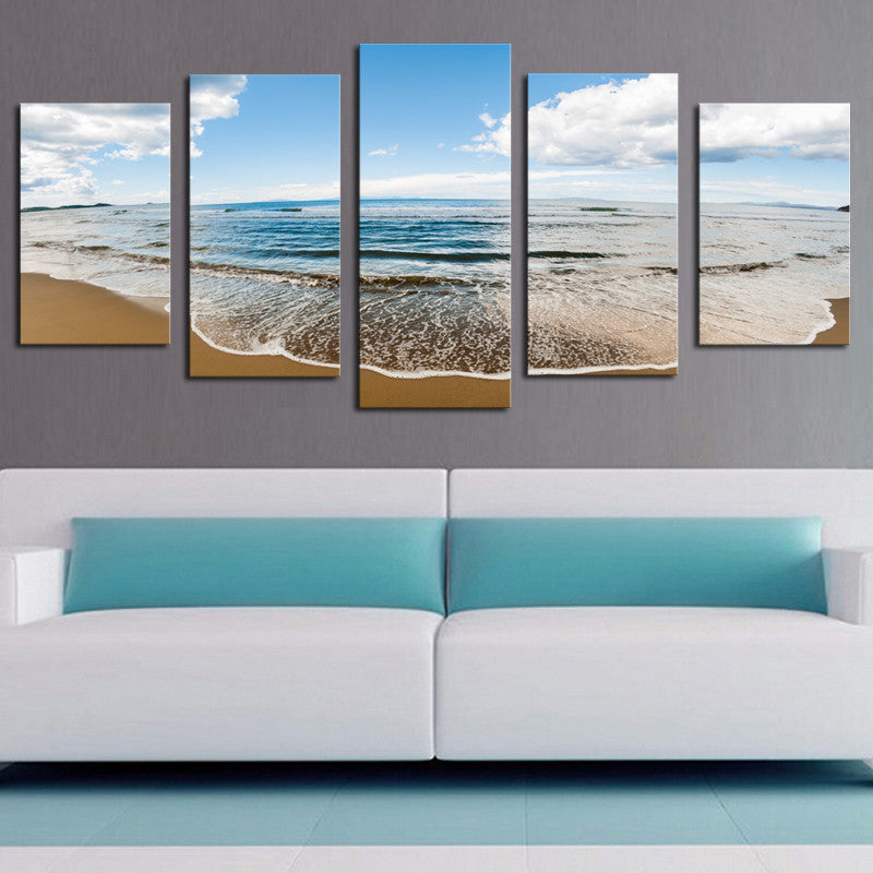 Sprawling Beach - Five panel canvas art featuring a serene coastal landscape with gentle waves rolling onto golden sand under a bright blue sky with scattered white clouds, perfect for beach-themed home decor