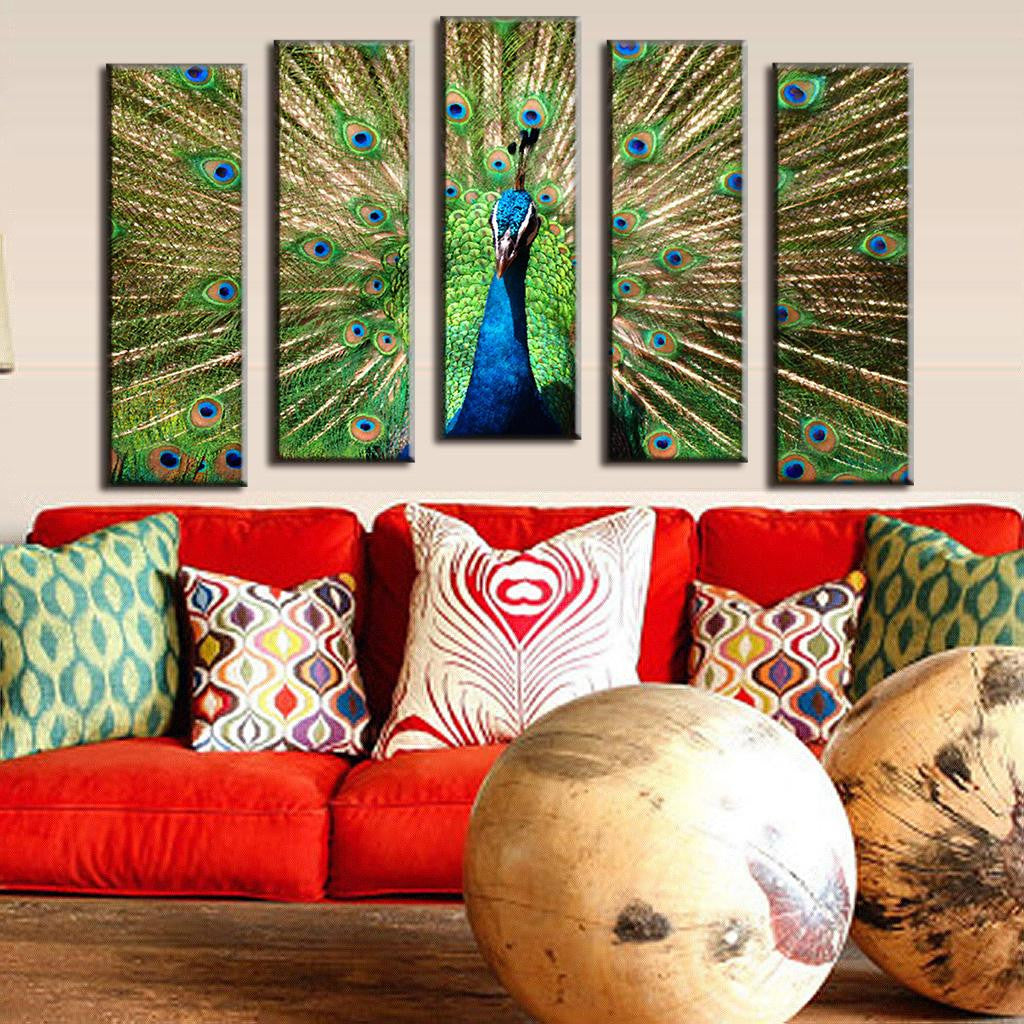 Beautiful Abstract Peacock 5-piece canvas wall art featuring vibrant blue and green peacock with spreading golden feathers, displayed above red sofa with decorative pillows, perfect for modern home decor