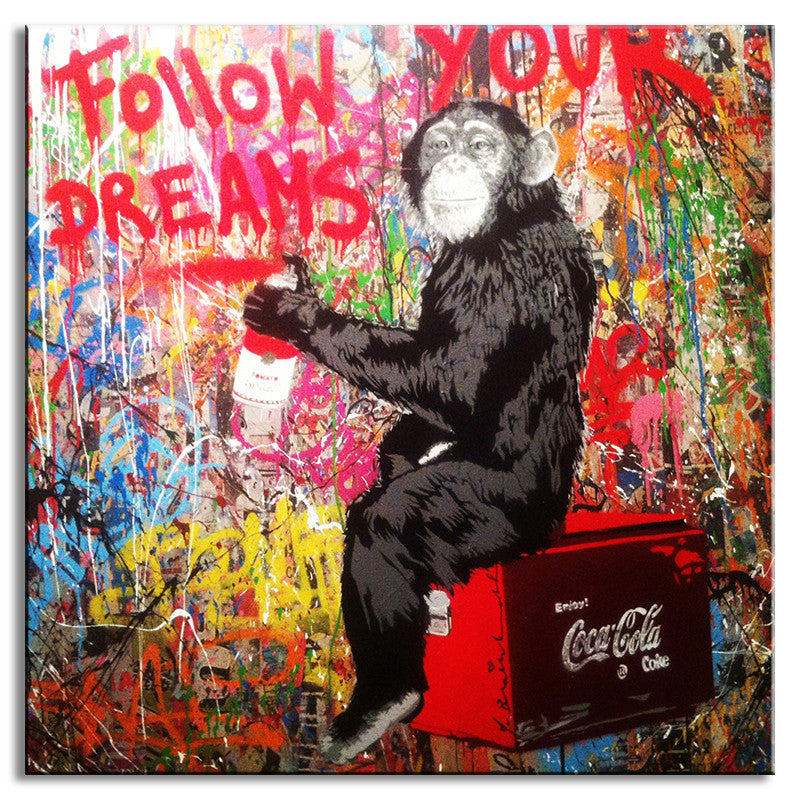 Follow Your Dreams Monkey - Banksy street art canvas print featuring a chimpanzee sitting on a red Coca-Cola cooler against a vibrant graffiti wall with splattered paint and 'Follow Your Dreams' text in red