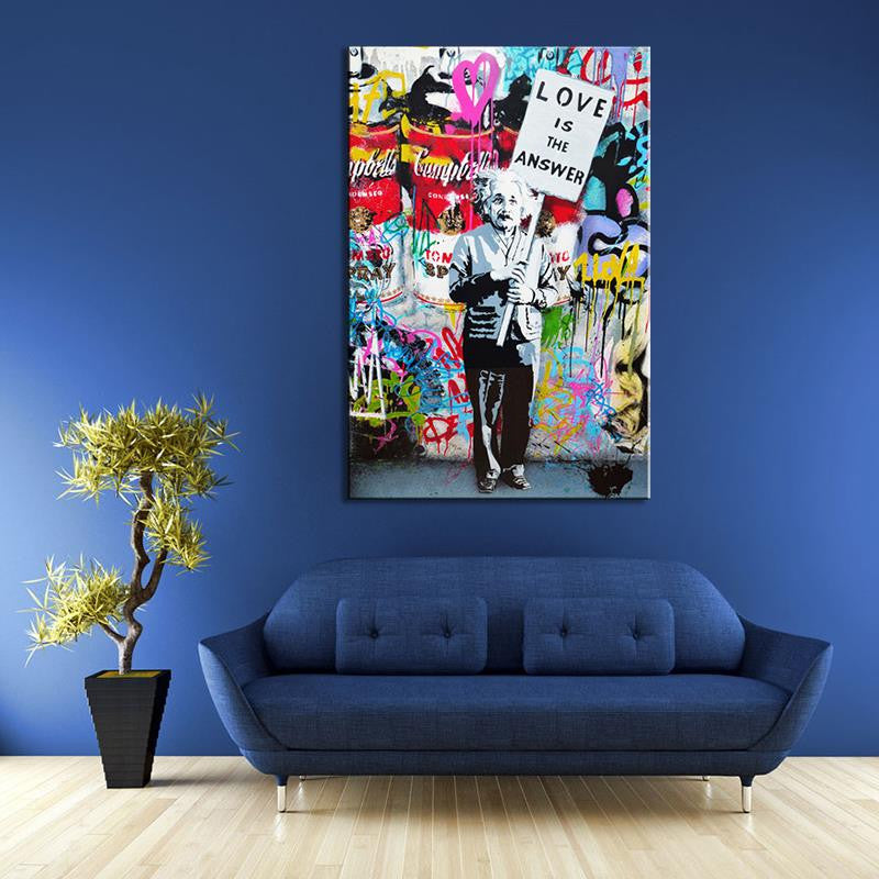 Love Is The Answer Banksy street art canvas print featuring colorful graffiti background with protest sign message against vibrant wall, displayed in modern living room with blue sofa