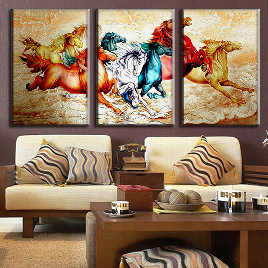 Chinoiserie Horses: Vibrant 3-panel canvas wall art featuring galloping horses in dynamic colors of red, blue, and gold against an oriental-style background, displayed above modern living room furniture