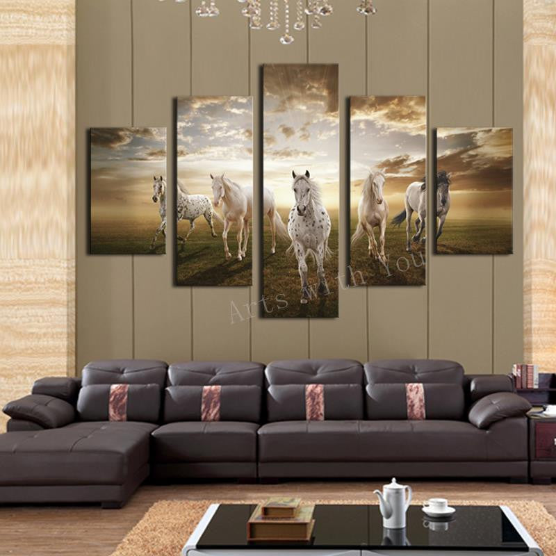 Beautiful Running Horses - Five panel canvas wall art featuring majestic white horses galloping across a meadow at sunset, with dramatic golden clouds in the background, perfect for living room decor