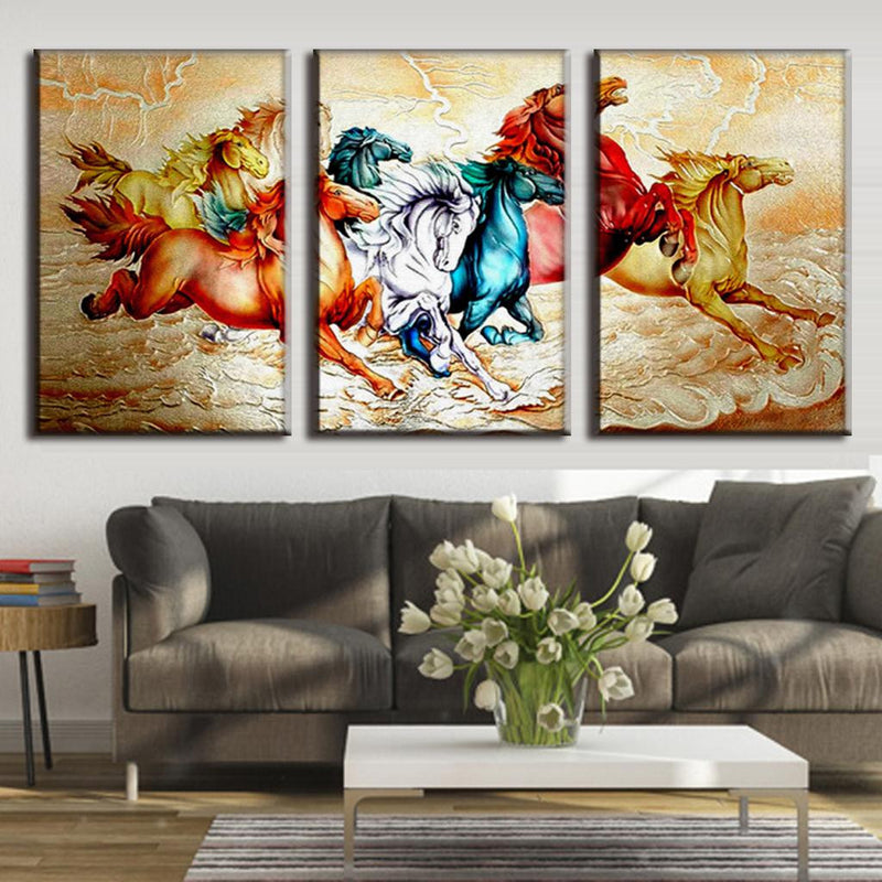 Chinoiserie Horses: Vibrant 3-panel canvas wall art featuring galloping horses in red, blue, white, and yellow tones against a golden background, painted in traditional Asian artistic style with flowing movement and decorative details