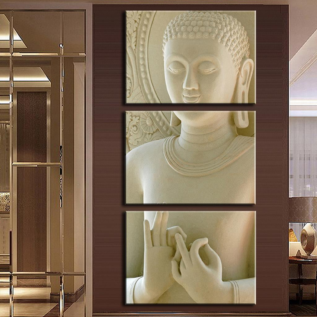 Modern Buddha Canvas - Serene 3-panel wall art featuring a detailed white Buddha statue with peaceful expression, ornate details, and meditation mudra gesture, displayed on brown wall