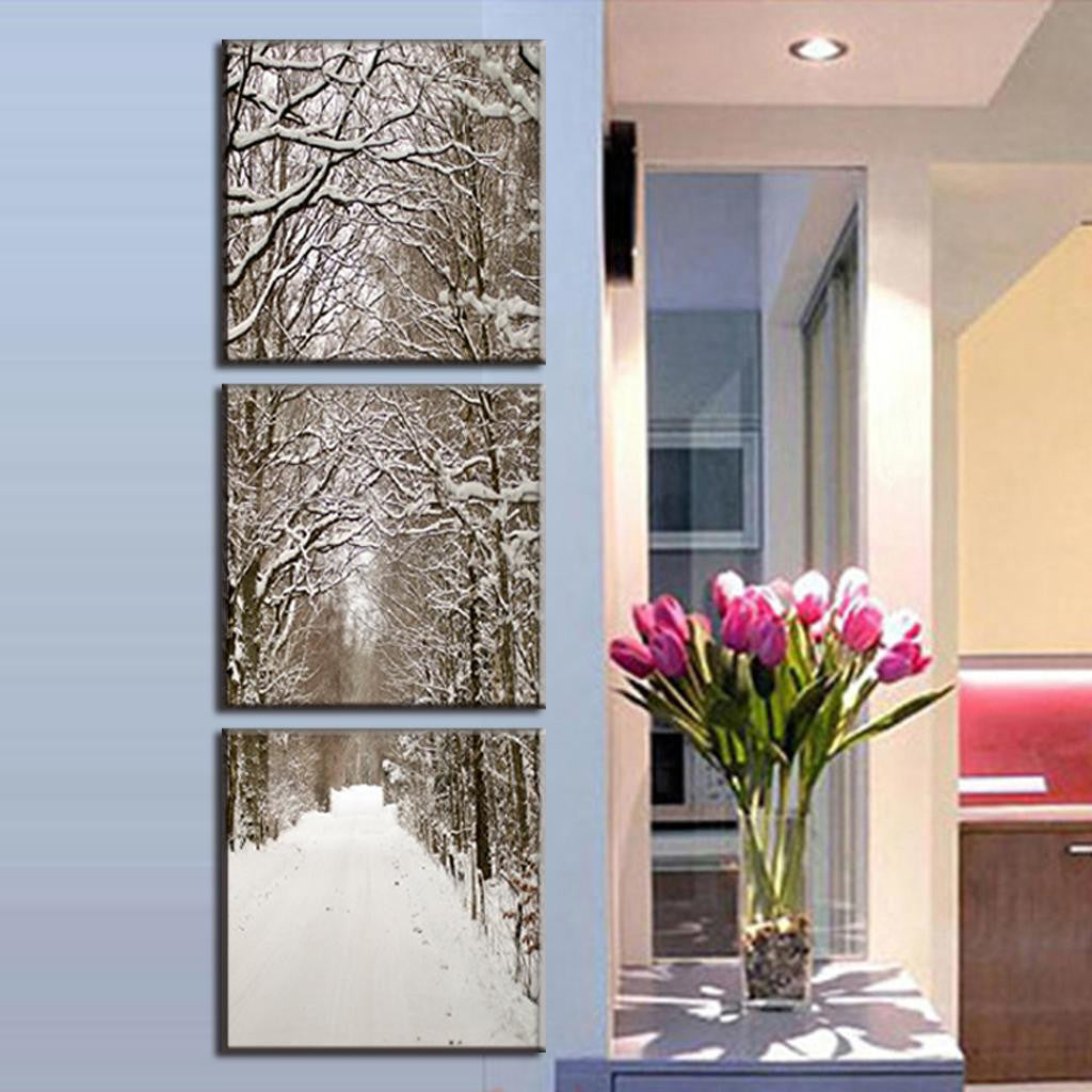 Snowy Winter Boulevard canvas wall art featuring a serene tree-lined pathway covered in snow, displayed as a vertical triptych panels perfect for modern home decor