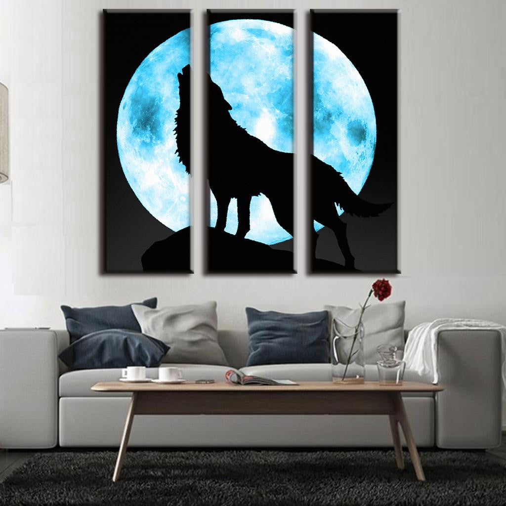 Lone Wolf and Moon - 3-panel canvas wall art featuring silhouette of wolf howling against bright blue full moon on black background, dramatic nature scene perfect for home decor