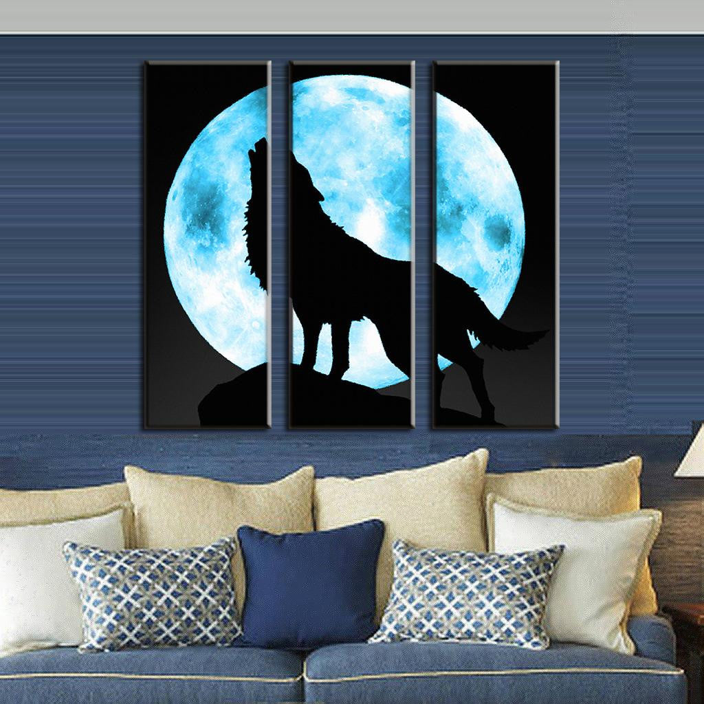 Lone Wolf and Moon - 3-panel canvas wall art featuring silhouette of wolf howling against bright blue full moon on black background, dramatic modern home decor piece