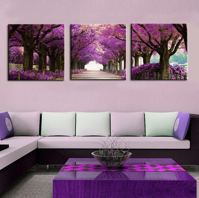 Purple Tree Path: Stunning 3-panel canvas wall art featuring a magical tunnel of blooming purple cherry blossom trees creating a serene pathway with natural light at the end, perfect for modern home decor