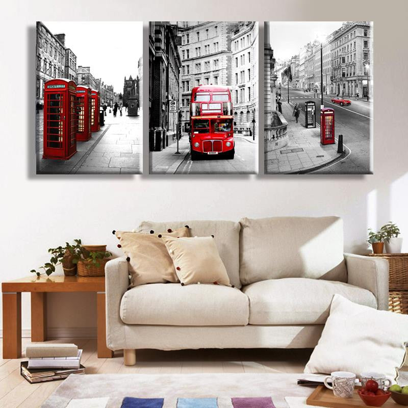 London Landscape Panel Art featuring iconic black and white cityscapes with red highlights showcasing vintage telephone booths and double-decker bus, displayed as a 3-piece canvas wall art set perfect for modern home decor