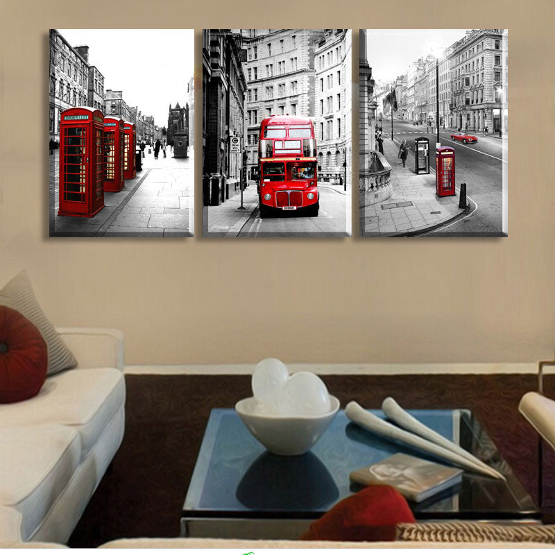 London Landscape Panel Art: Black and white triptych canvas print featuring iconic red British telephone booths and double-decker bus against monochrome London street scenes, creating striking visual contrast and urban nostalgia