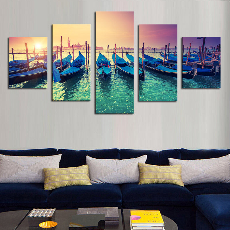 Boats in the Sunset - 5 Piece canvas wall art displaying traditional Venetian gondolas moored at sunset, with turquoise water reflecting vibrant orange and purple sky, creating a romantic Mediterranean harbor scene