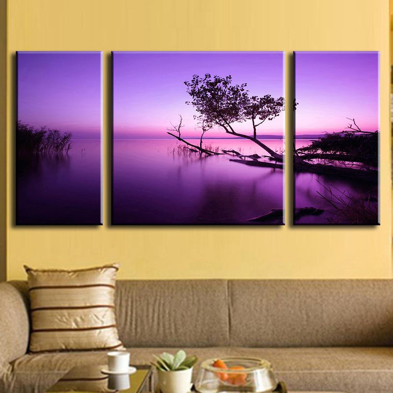 Purple Sky Tree on Water: Stunning 3-panel canvas art featuring a silhouetted tree against a vibrant purple sunset, reflecting dramatically on calm water creating a serene waterscape landscape wall decor
