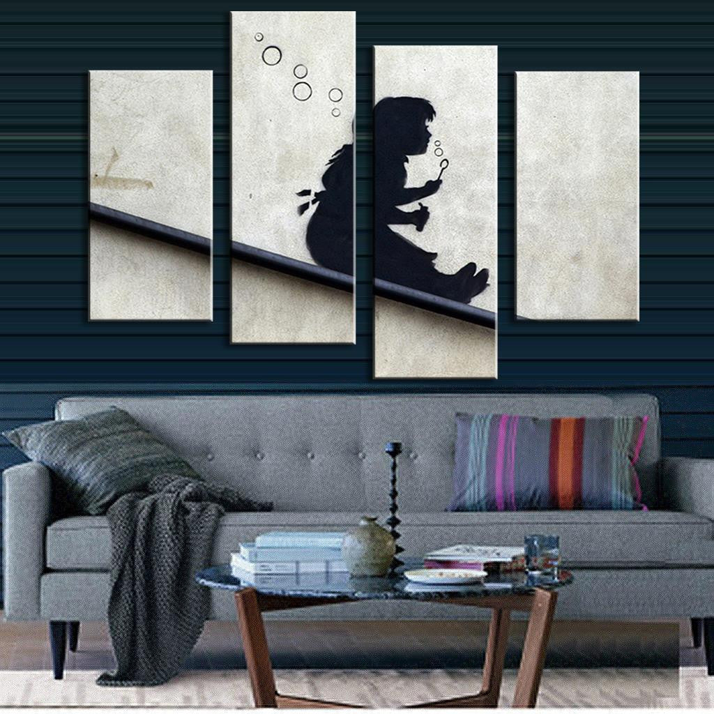 Blowing Bubbles On The Roof - Banksy artwork shows silhouette seated on slanted surface blowing bubbles against light background, split across 4 canvas panels, modern graffiti art style