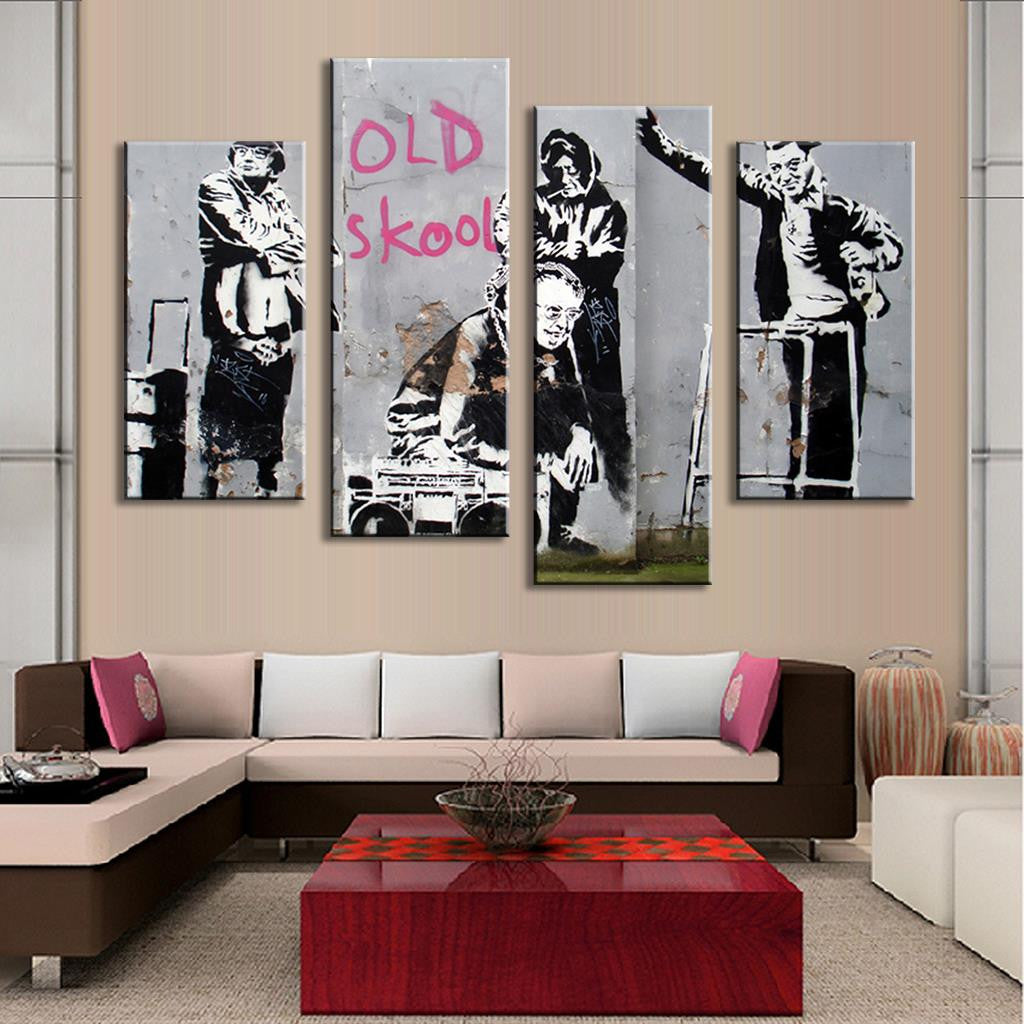 Old Skool Banksy canvas wall art featuring black and white street art panels with pink text, showing retro boombox and urban figures in graffiti style, modern 5-panel home decor piece displayed above contemporary sofa