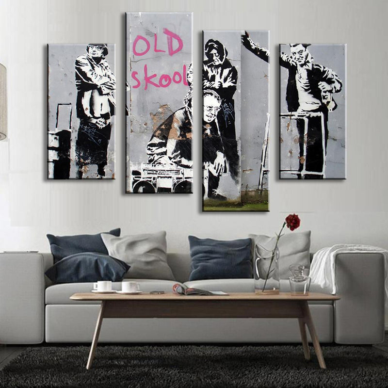 Old Skool Banksy canvas wall art featuring iconic street art style in black and pink graffiti, displayed as a 5-panel modern urban artwork above grey sofa in contemporary living room setting