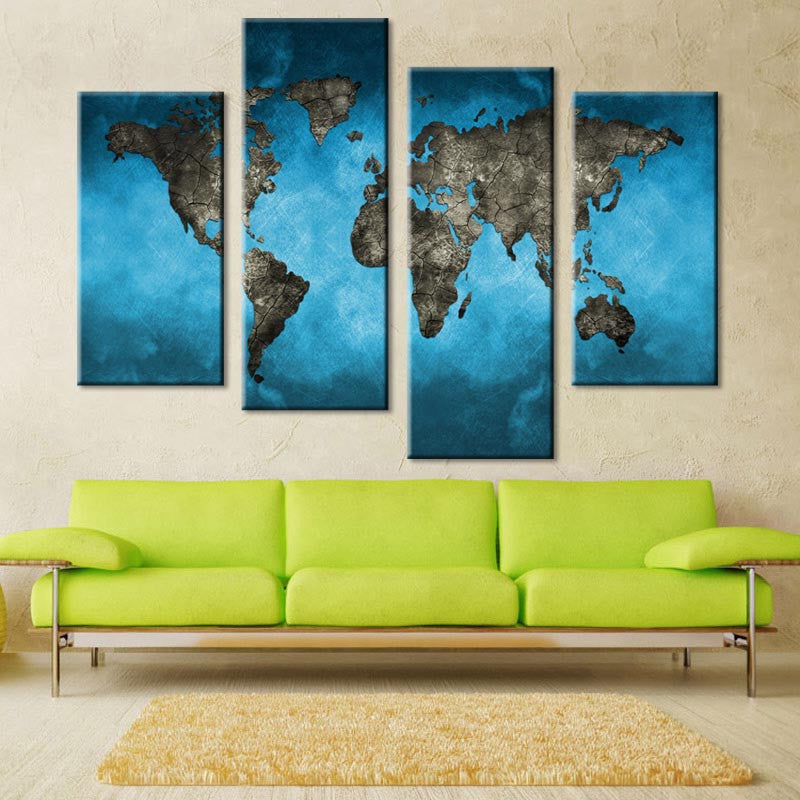 World Map on Blue Canvas - 4-panel wall art displaying a stylized global map in dark grey against vibrant turquoise blue background, mounted above lime green sofa, perfect for modern home decor, 48x36 inches total size