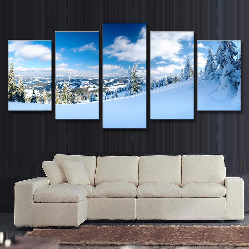Winter Mountain Landscape canvas print featuring snow-covered pine trees on a mountain slope, pristine white snow fields, and majestic mountain peaks under bright blue sky with fluffy white clouds, perfect for wall decor