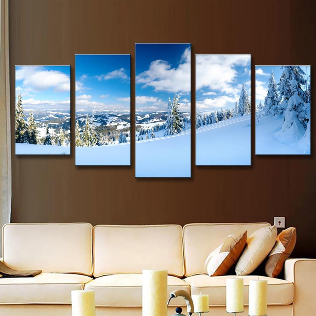 Winter Mountain Landscape: Stunning 5-panel canvas print showing snow-covered mountain peaks, frost-laden evergreens, and pristine white slopes under bright blue skies with fluffy clouds, creating a serene winter wonderland panorama