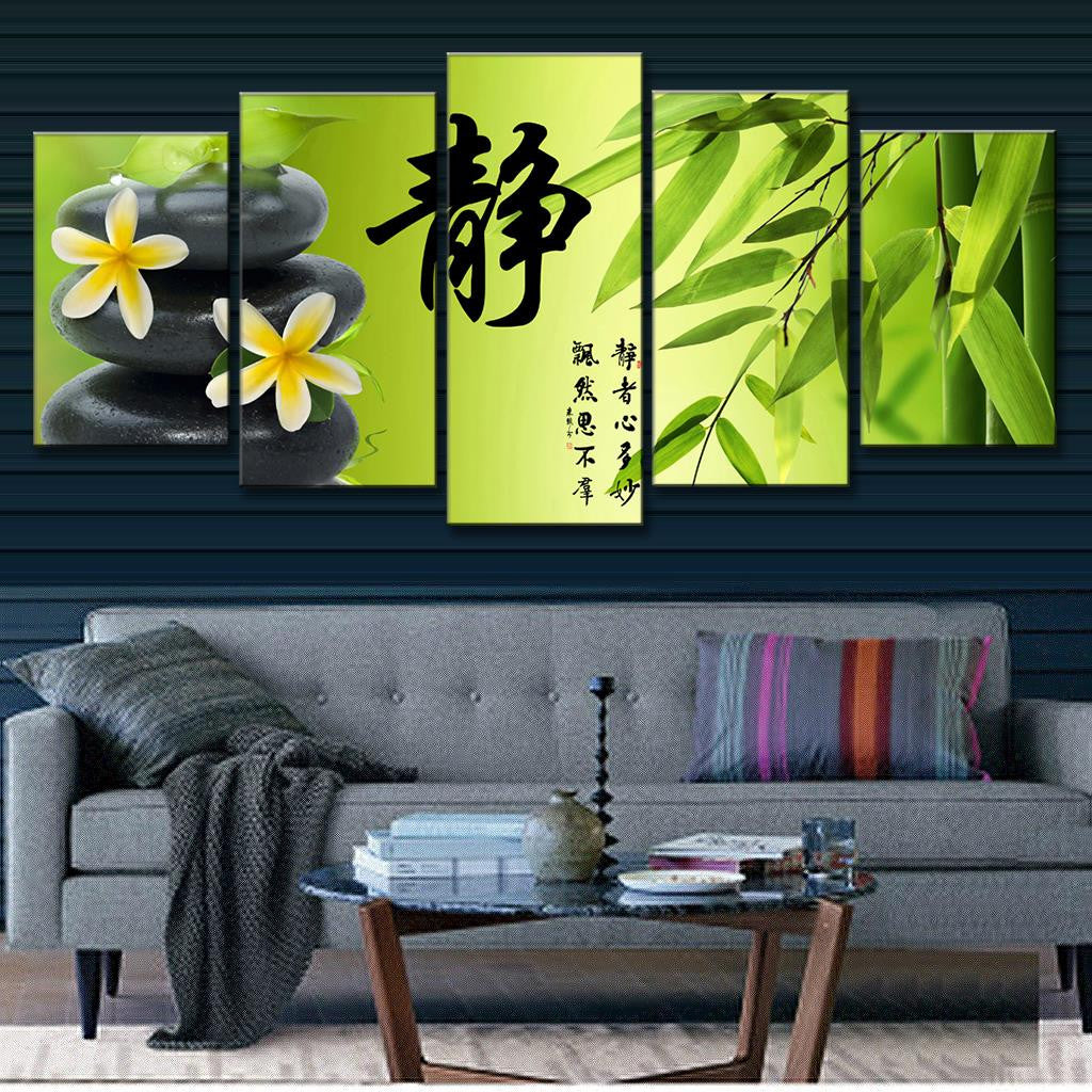 Bamboo and Stone with Flower - Zen garden wall art featuring plumeria flowers on black stones, Japanese calligraphy, and fresh bamboo leaves against a green backdrop, perfect for spa or meditation room decor