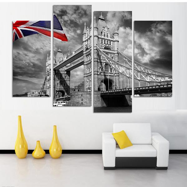 London Bridge with Union Jack - dramatic black and white canvas wall art featuring Tower Bridge architecture with red, white and blue British flag against moody cloudy sky, split into multi-panel display format