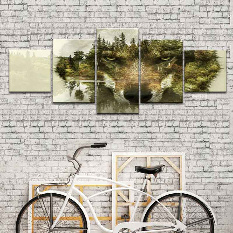 Modern Wolf Face with Nature Background - 5-panel wall art featuring double exposure wolf portrait blending with forest landscape, evergreen trees and mountain scenery in earth tones, displayed on white brick wall above vintage bicycle