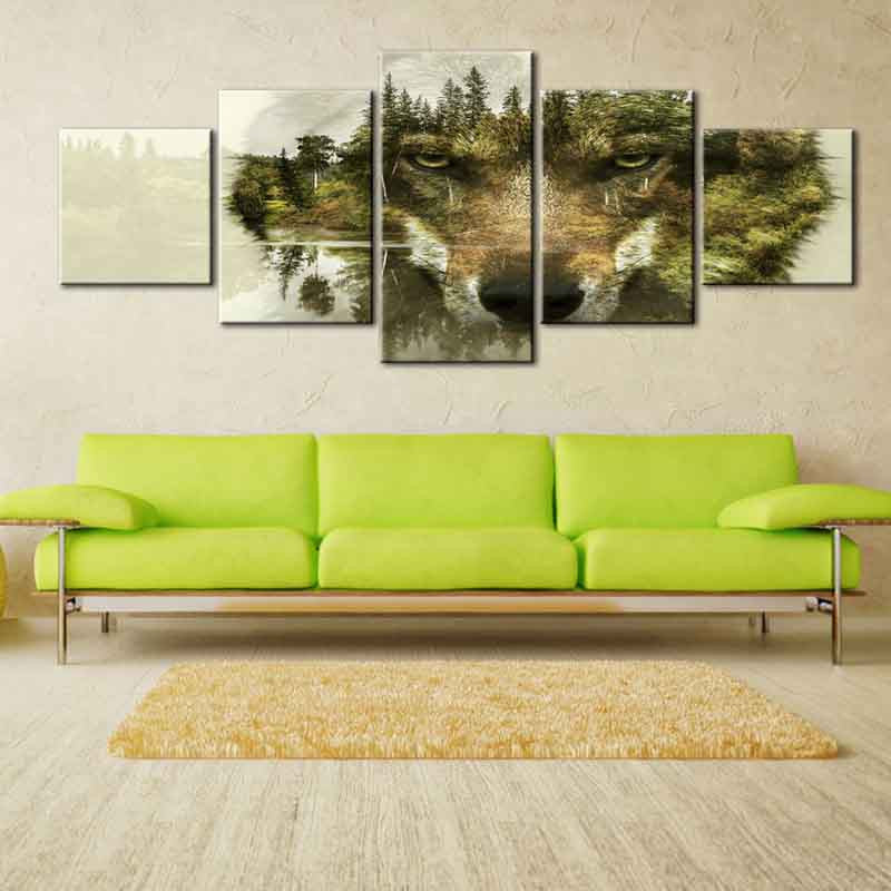 Modern Wolf Face with Nature Background - 5-panel canvas wall art featuring a wolf's intense gaze blended with forest scenery, pine trees and misty landscape, displayed above lime green sofa