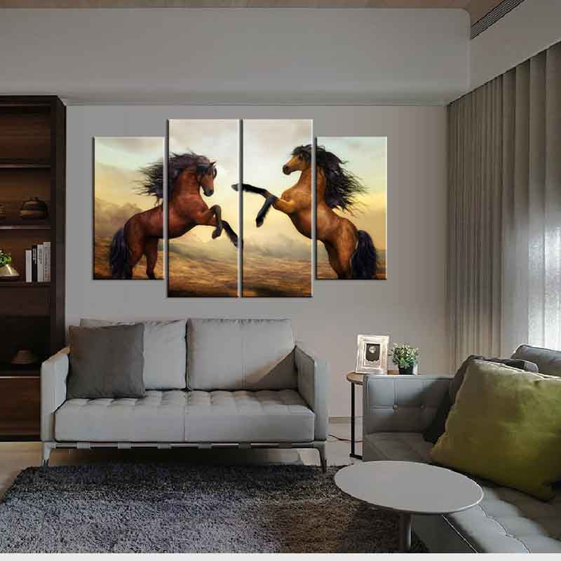 Dancing Horses: 4-panel canvas wall art featuring majestic brown horses rearing up against a dramatic sunset sky, displayed in modern living room setting with neutral decor, perfect for home wall decoration