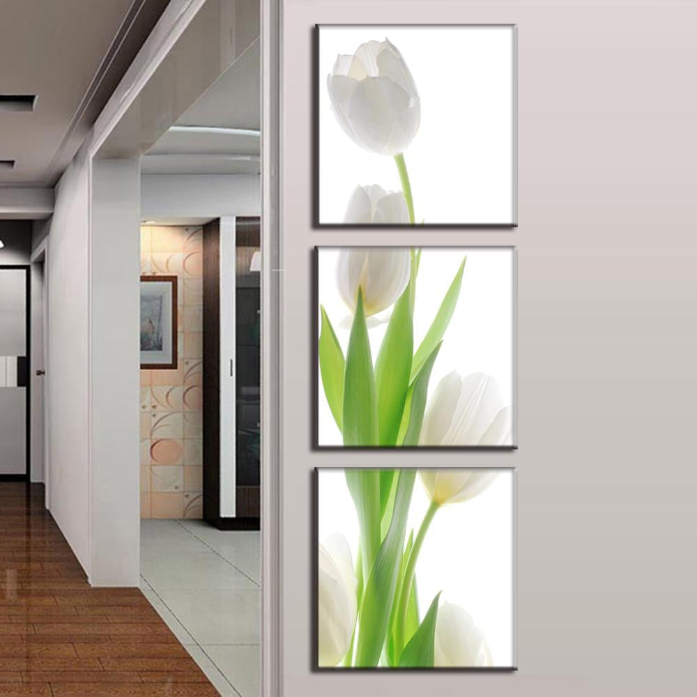 White Tulip Modern Design: Elegant 3-panel canvas art featuring minimalist white tulips with vibrant green stems on light background, perfect for modern home decor. High-quality wall art creates dramatic vertical display.