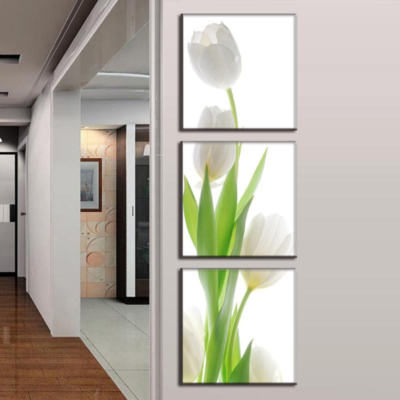 White Tulip Modern Design: Elegant 3-panel canvas art featuring minimalist white tulips with vibrant green stems on light background, perfect for modern home decor. High-quality wall art creates dramatic vertical display.
