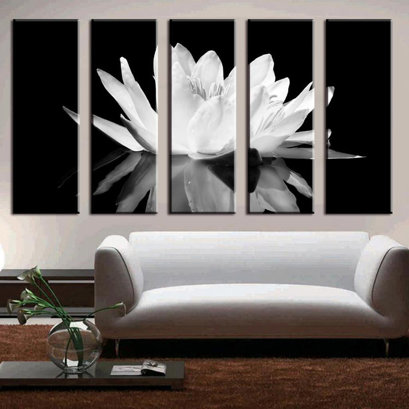White Lotus on Black - 5-panel canvas wall art featuring a striking monochrome lotus flower in full bloom against a dark background, creating dramatic contrast in a modern living room setting with white furniture.