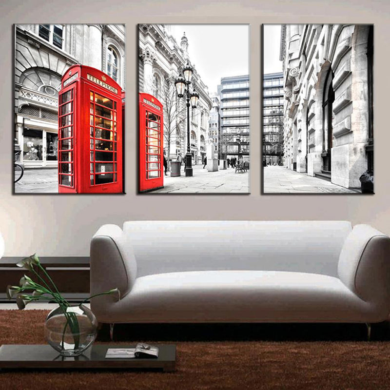 London Scene with Red Telephone Booths: Black and white cityscape featuring iconic red British phone boxes against historic architecture, vintage street lamps, and classic buildings, split into three canvas panels for wall art display