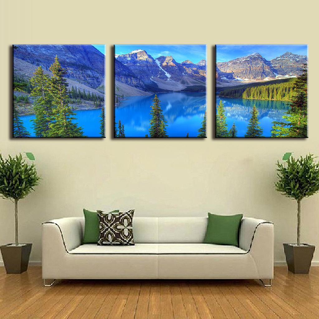 Blue Mountain Alps: 3-panel canvas wall art featuring stunning mountain landscape with pristine turquoise lake, snow-capped peaks, and evergreen trees reflecting in crystal clear alpine waters