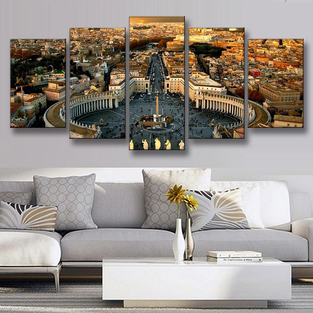 The Roman Forum Panoramic - Aerial view of St Peters Square in Vatican City showing curved colonnades, central obelisk and surrounding historic Roman architecture during golden sunset hour