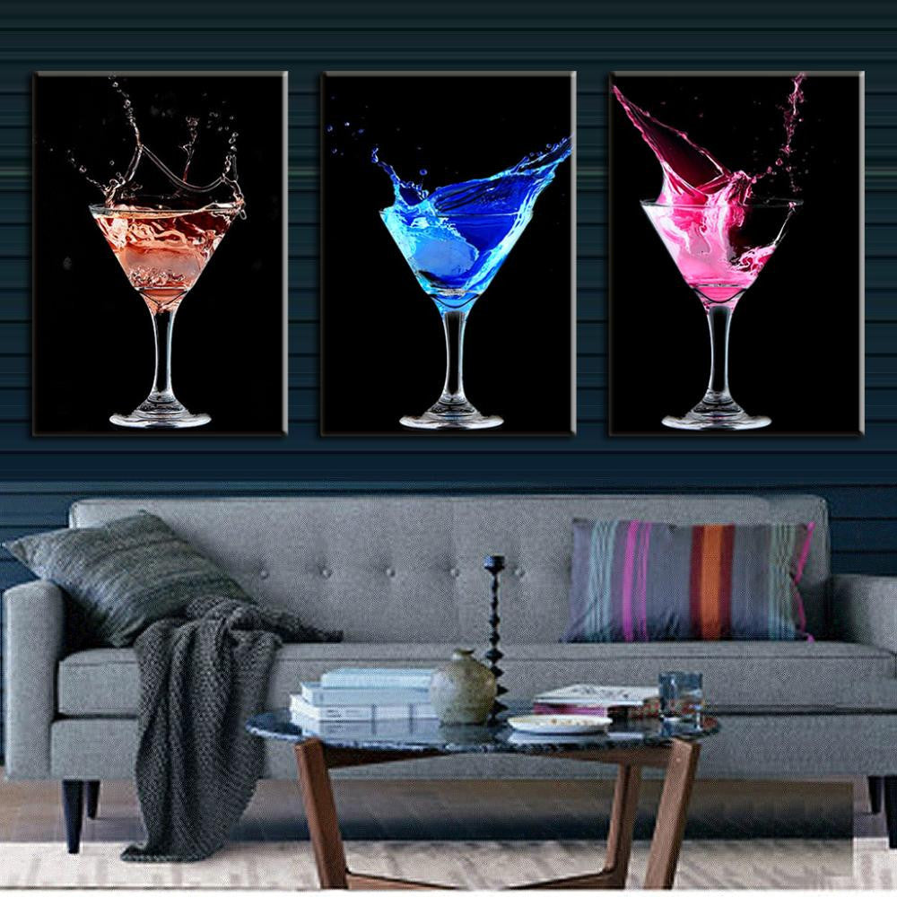Colorful Cocktails: Three-panel wall art featuring vibrant splashing martinis in red, blue, and pink against black backgrounds, elegantly displayed in crystal glasses, perfect for bar or dining room decor