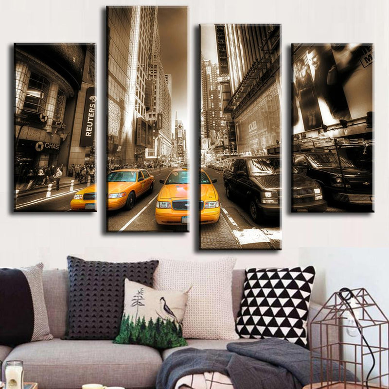 New York Streets - Yellow Taxis canvas art showing iconic yellow cabs against sepia-toned Manhattan cityscape with towering skyscrapers, busy streets and urban architecture in a 4-panel split wall decor arrangement