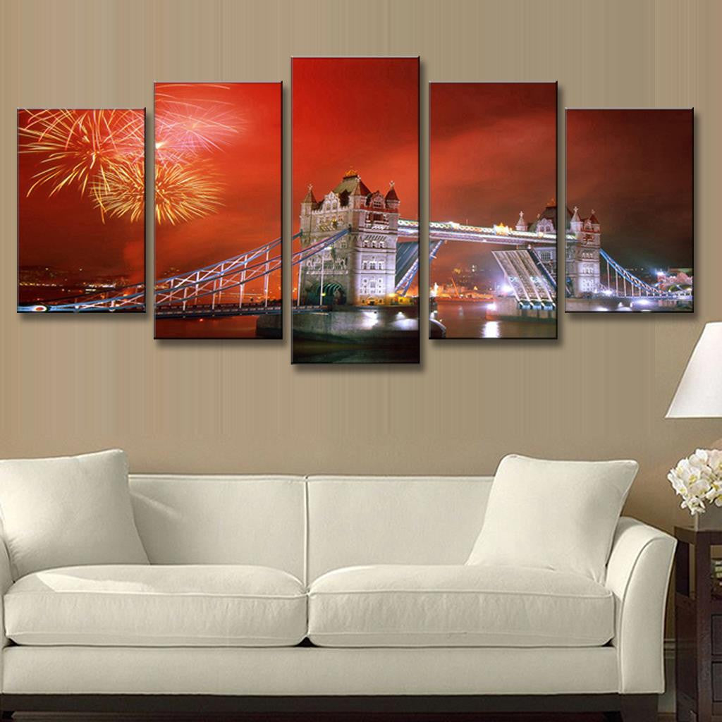 London Tower Bridge with Fireworks - 5-panel canvas art displaying illuminated Tower Bridge against dramatic red sky with golden fireworks bursting overhead, reflecting on Thames River. Perfect wall decor showcasing iconic London landmark at night.