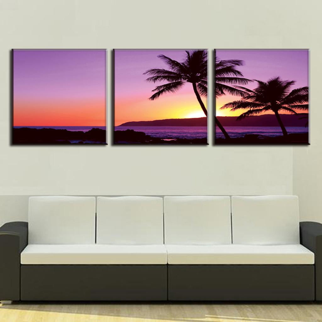 Purple Seascape Sunset - 3-panel canvas wall art featuring silhouetted palm trees against a vibrant purple and orange ocean sunset, with rolling waves and distant mountains creating a tranquil tropical beach scene