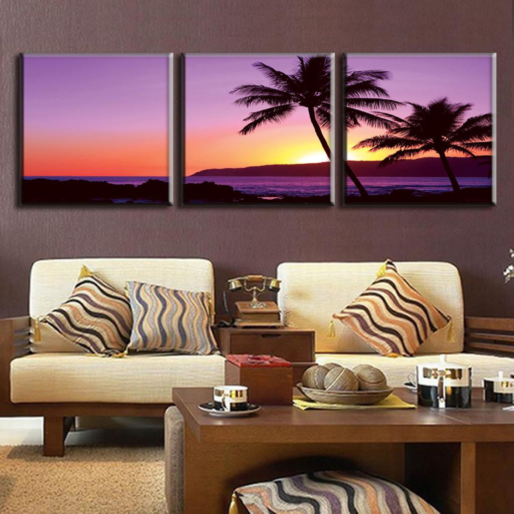 Purple Seascape Sunset - 3-panel canvas wall art featuring silhouetted palm trees against a vibrant purple and orange tropical beach sunset over calm ocean waters, perfect for coastal home decor