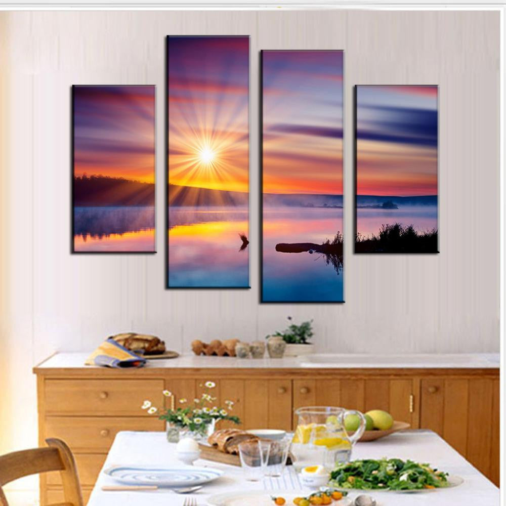Colorful Sunset with Glare - 4 panel canvas wall art featuring a vibrant sunset over water with sunburst reflection, purple and orange sky, silhouetted landscape, perfect for home decor and interior design