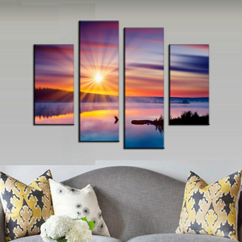 Colorful Sunset with Glare - 4-panel canvas wall art featuring dramatic sunburst over tranquil lake, vibrant purple and orange sky reflecting in mirror-like water, with silhouetted landscape creating peaceful scenery perfect for home decor