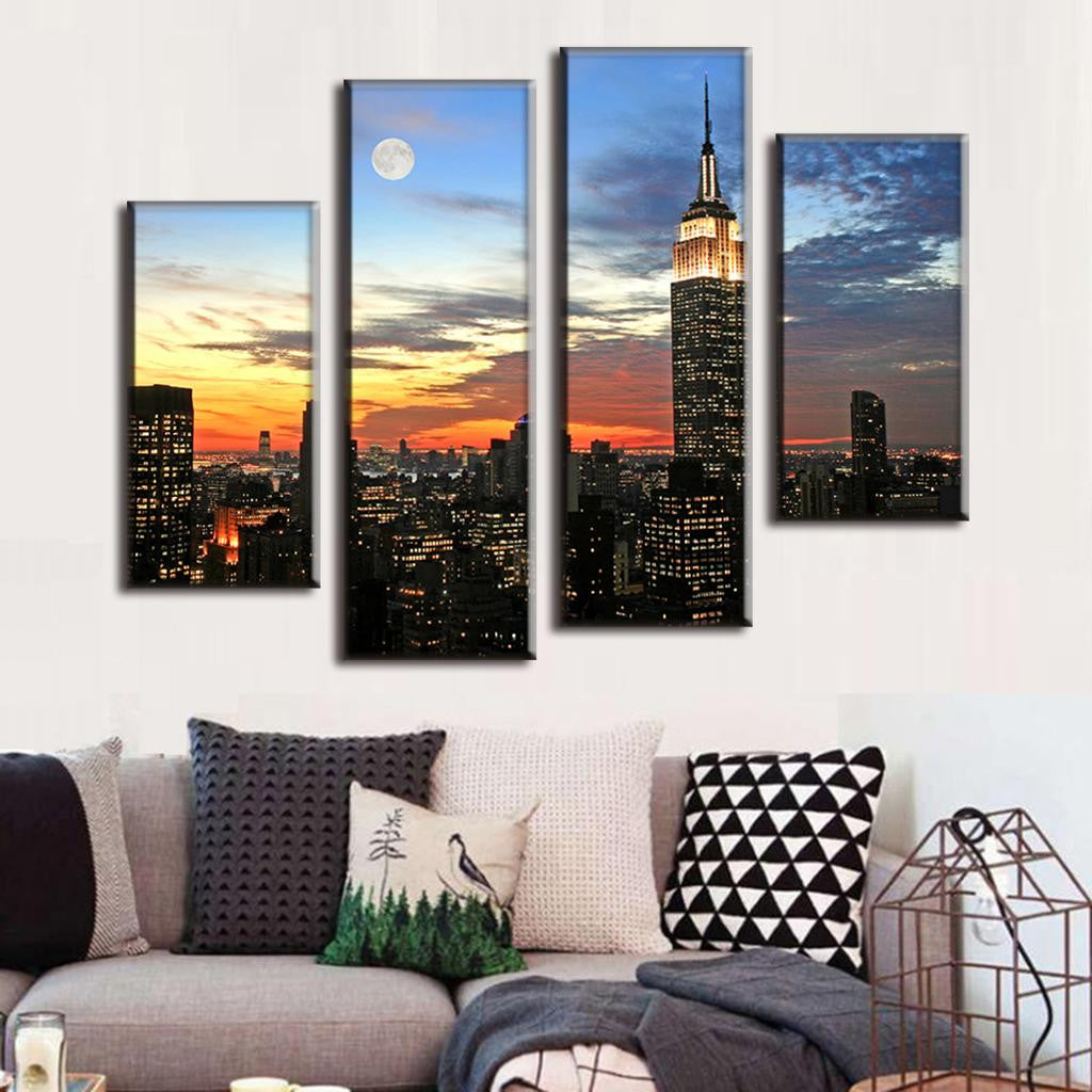 New York Moon and Sunset canvas wall art showing Empire State Building illuminated at dusk with full moon, dramatic orange sunset sky, and city skyline silhouette in 4-panel split canvas display