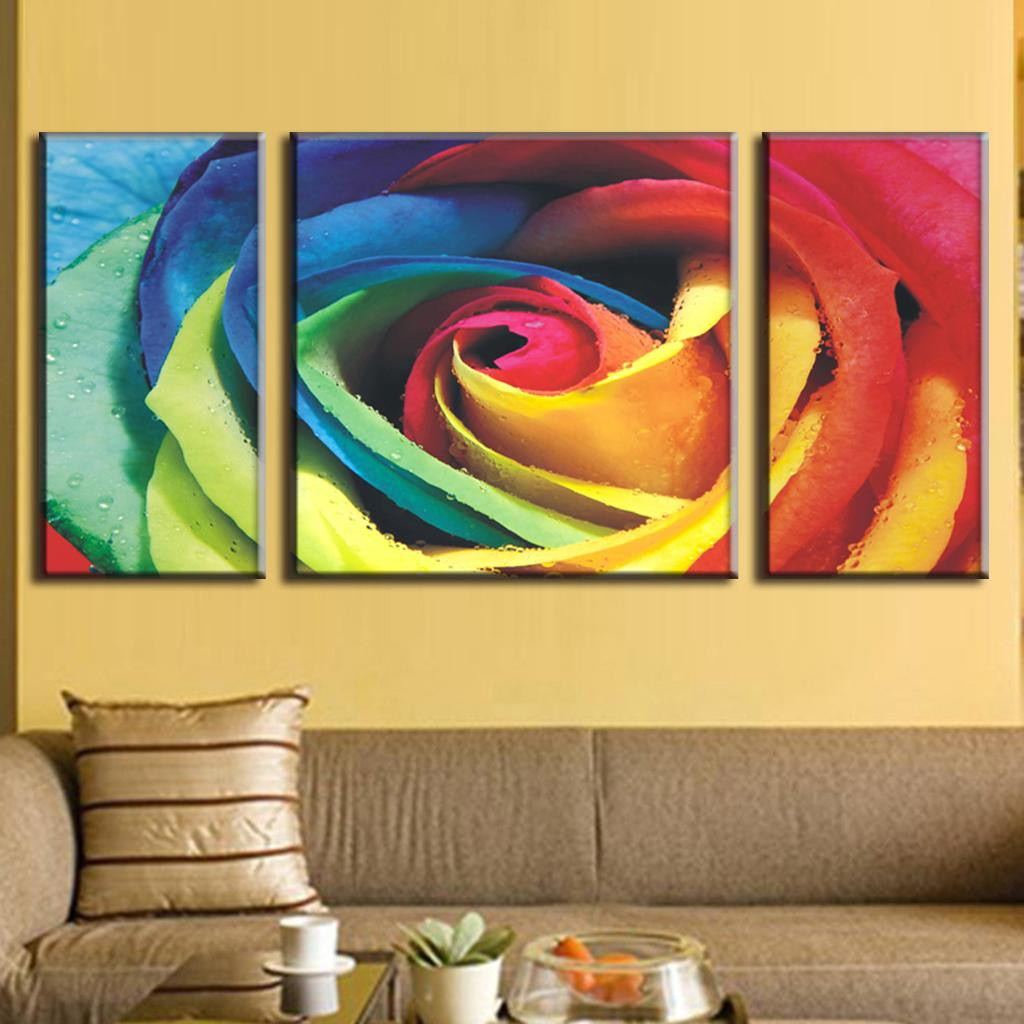 Abstract Rose with Colors - Vibrant rainbow-colored rose petals in close-up macro photography, split across three canvas panels creating a stunning multicolor floral wall art display with bold hues of blue, green, yellow, and red